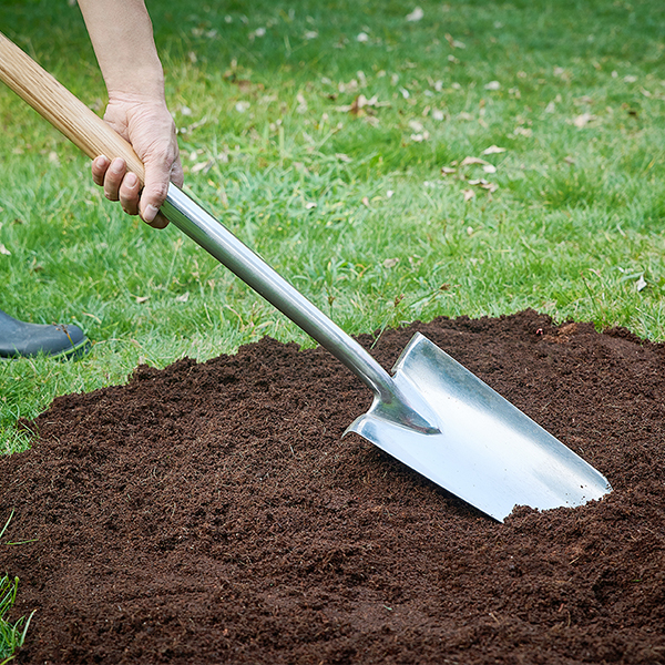 Stainless Steel Long Handled Planting Spade In-Use Image Stainless Steel Long Handled Planting Spade - Image 3