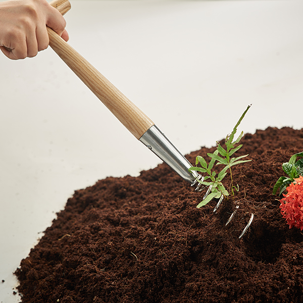 Stainless Steel Hand Corkscrew Weeder In-Use Image Stainless Steel Hand Corkscrew Weeder - Image 2